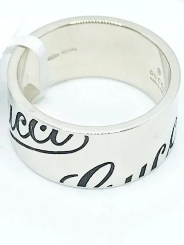 Gucci 18KWG Black Cursive Gucci Wide Band Wing Size 6.5 — DeWitt's